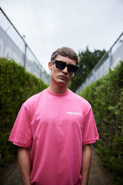 T-Shirt hot pink 'money isn’t everything'